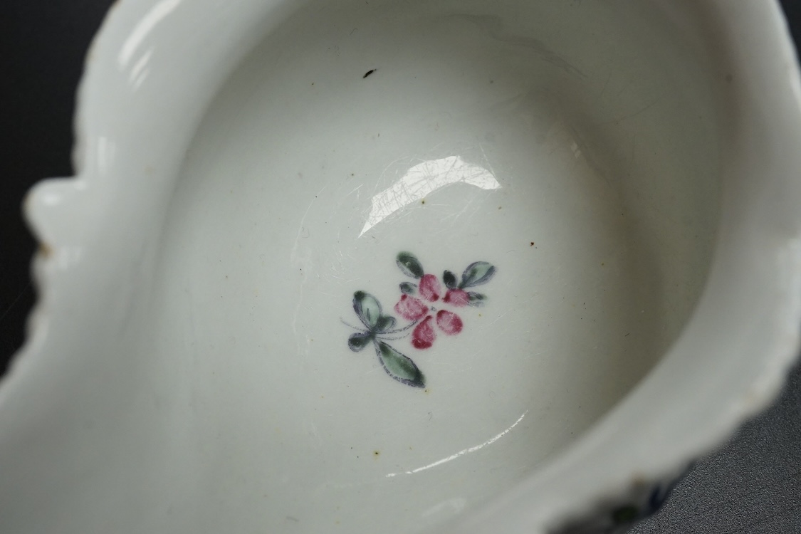 A Liverpool porcelain sauceboat, handpainted with flowers, circa 1760, 14cm wide